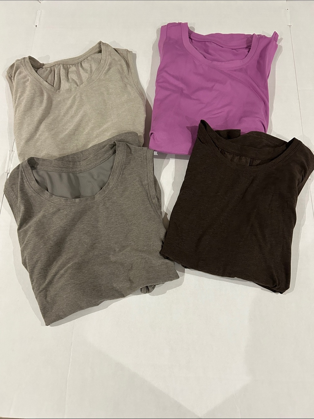Bundle of 4 athletic tanks size medium